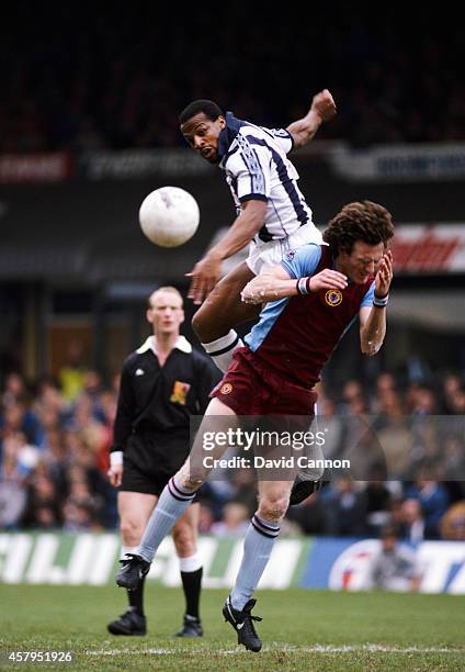 Aston Villa defender Allan Evans is beaten to the ball by West Brom striker Cyrille Regis during a League Division One match between Aston Villa and...