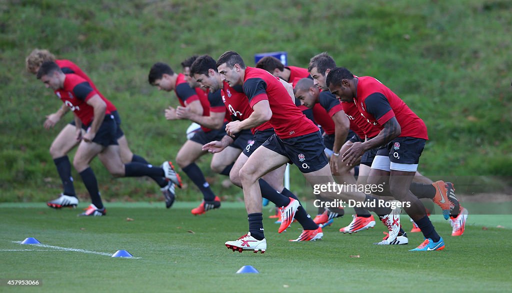 England Rugby Training Rucks The England rugby team warm up on the new Desso hybrid grass pitch ...