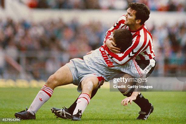 Southampton defender Neil 'Razor' Ruddock gets to grips with Liverpool player Peter Beardsley during a Division One match between Southampton and...
