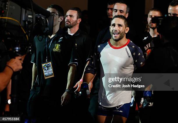 Chad Mendes enters the arena before his featherweight championship bout against Jose Aldo of Brazil during the UFC 179 event at Maracanazinho on...