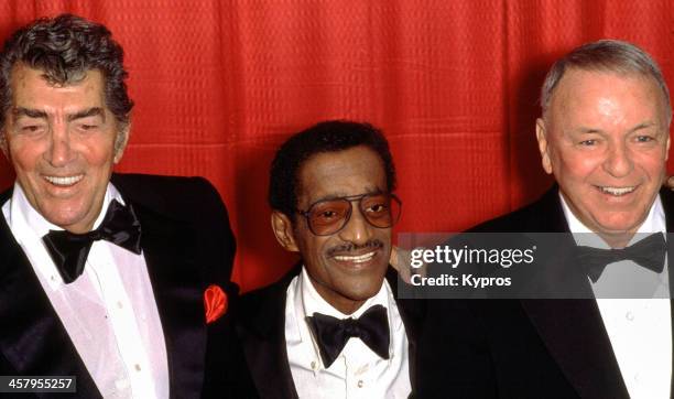 Legendary 'Rat Pack' entertainers Dean Martin, Sammy Davis Jr. And Frank Sinatra pose for photos at a press conference announcing their 1988...