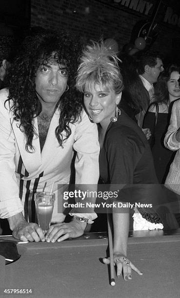 Singer Samantha Fox carried a big pool stick during her birthday celebration with ex-Kiss member Paul Stanley.