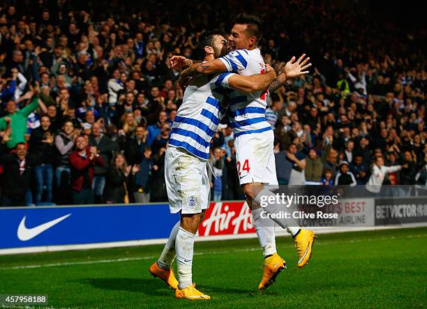 Charlie Austin of QPR celebrates scoring their second goal with Eduardo Vargas of QPR during the Barclays Premier League match between Queens Park...