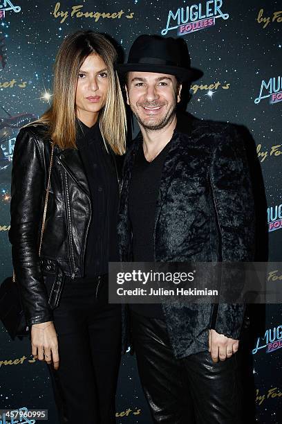 Michael Youn and his wife Isabelle Funaro attend "Mugler Follies" Paris New Variety Show - Premiere on December 19, 2013 in Paris, France.