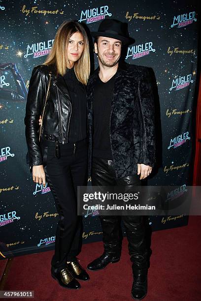 Michael Youn and his wife Isabelle Funaro attend "Mugler Follies" Paris New Variety Show - Premiere on December 19, 2013 in Paris, France.