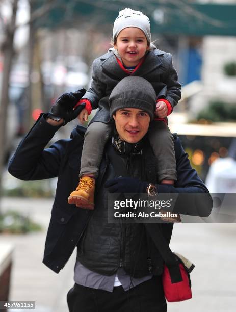 Orlando Bloom and Flynn Christopher Bloom are seen in Midtown on December 19, 2013 in New York City.