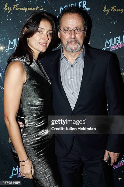Jean Reno and his wife Zofia Borucka attend "Mugler Follies" Paris New Variety Show - Premiere on December 19, 2013 in Paris, France.