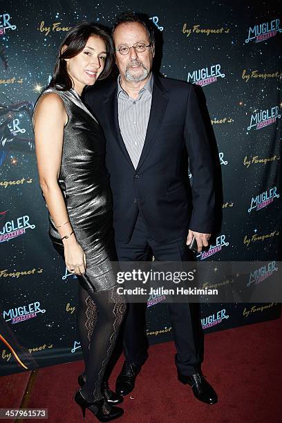 Jean Reno and his wife Zofia Borucka attend "Mugler Follies" Paris New Variety Show - Premiere on December 19, 2013 in Paris, France.