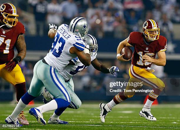 Colt McCoy of the Washington Redskins is chased from the pocket by Rolando McClain of the Dallas Cowboys and Anthony Spencer of the Dallas Cowboys...
