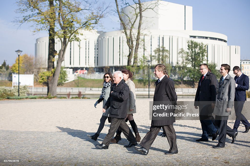 Former Polish Prime Minister Leszek Miller (center)...