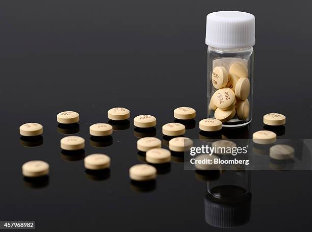 Avigan influenza tablets, produced by Fujifilm Holdings Corp., are arranged for a photograph at the company's headquarters in Tokyo, Japan, on...