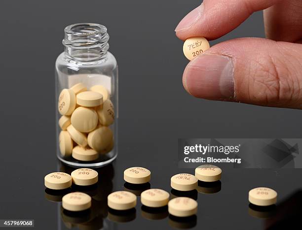 Avigan influenza tablets, produced by Fujifilm Holdings Corp., are arranged for a photograph at the company's headquarters in Tokyo, Japan, on...