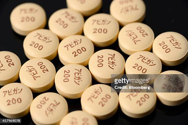 Avigan influenza tablets, produced by Fujifilm Holdings Corp., are arranged for a photograph at the company's headquarters in Tokyo, Japan, on...