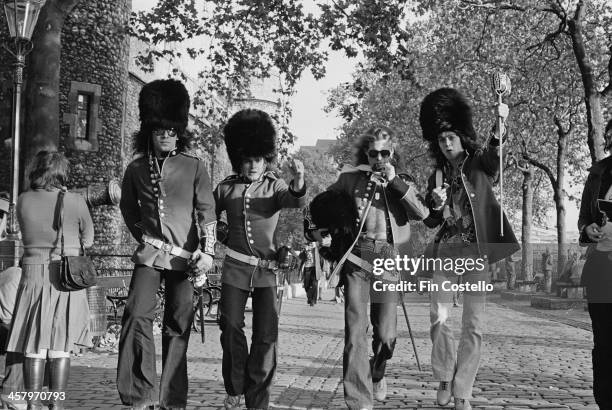 American group Van Halen posed wearing uniforms of the King's Troop, Royal Horse Artillery holding swords in front of the Tower Of London in 1978....