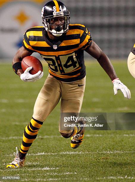 Antonio Brown of the Pittsburgh Steelers runs after making a catch during the game against the Indianapolis Colts on September 26, 2014 at Heinz...