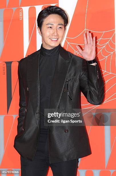 Jung Il-Woo poses for photographs during the W Korea campaign "Love Your W" party at Fradia on October 23, 2014 in Seoul, South Korea.