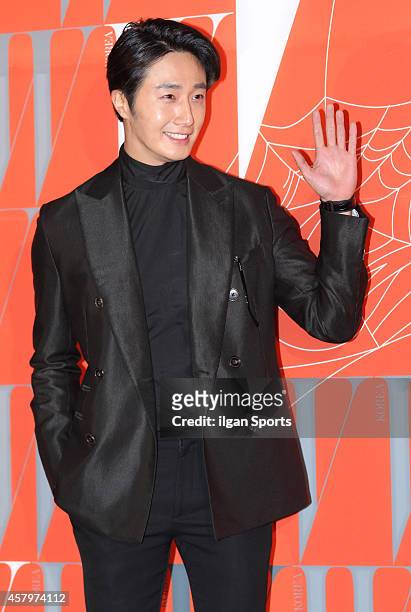 Jung Il-Woo poses for photographs during the W Korea campaign "Love Your W" party at Fradia on October 23, 2014 in Seoul, South Korea.