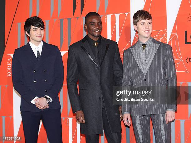 Robin Deiana, Samuel Okyere and Julian Quintart pose for photographs during the W Korea campaign "Love Your W" party at Fradia on October 23, 2014 in...