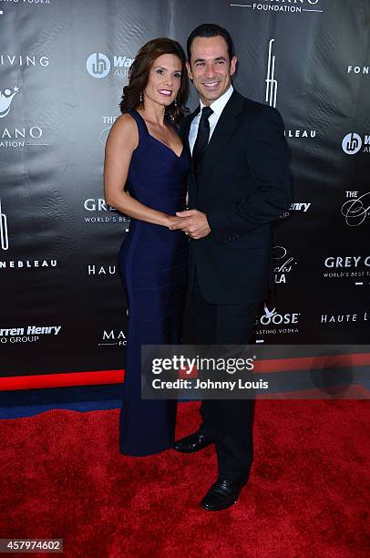 Adriana Henao and Helio Castroneves attend The Blacks Annual Gala at Fontainebleau Miami Beach on October 25, 2014 in Miami Beach, Florida.