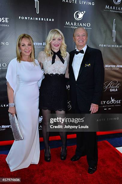 Lea Black, Courtney Love and Roy Black attend The Blacks Annual Gala at Fontainebleau Miami Beach on October 25, 2014 in Miami Beach, Florida.