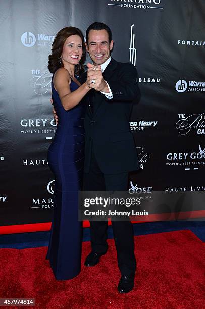 Adriana Henao and Helio Castroneves attend The Blacks Annual Gala at Fontainebleau Miami Beach on October 25, 2014 in Miami Beach, Florida.