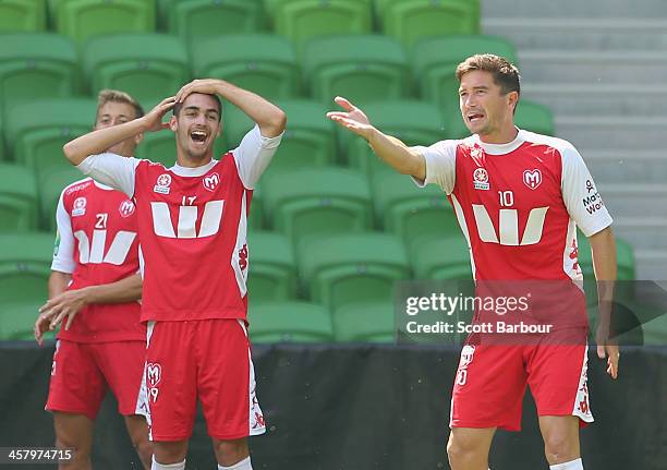 Harry Kewell gestures as Ben Garuccio looks on during a Melbourne Heart A-League training session at AAMI Park on December 20, 2013 in Melbourne,...