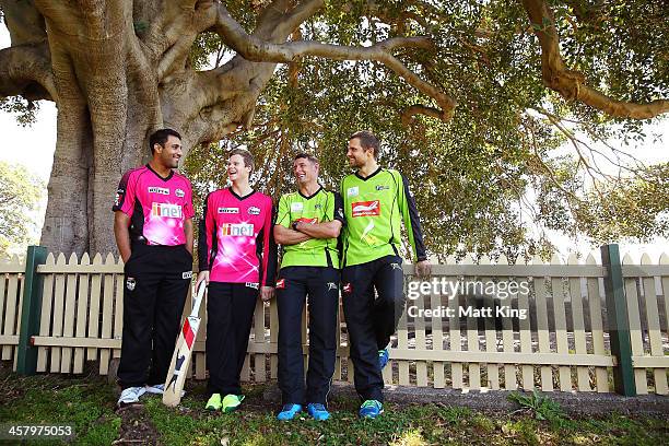 Ravi Bopara and Steve Smith of the Sixers and Mike Hussey and Dirk Nannes of the Thunder talk together during a joint Sydney Thunder and Sydney...