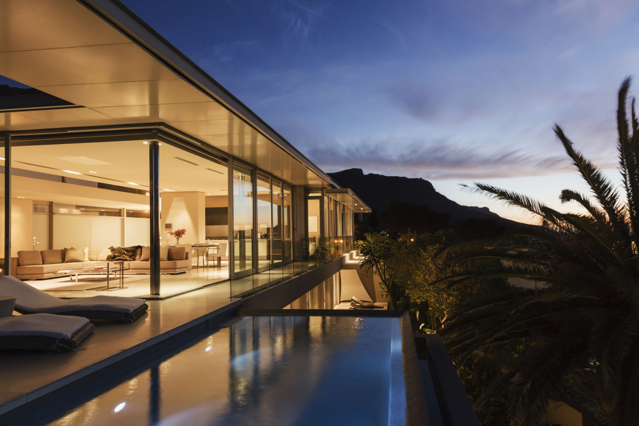 Modern house overlooking mountains at dusk Modern house overlooking mountains at dusk