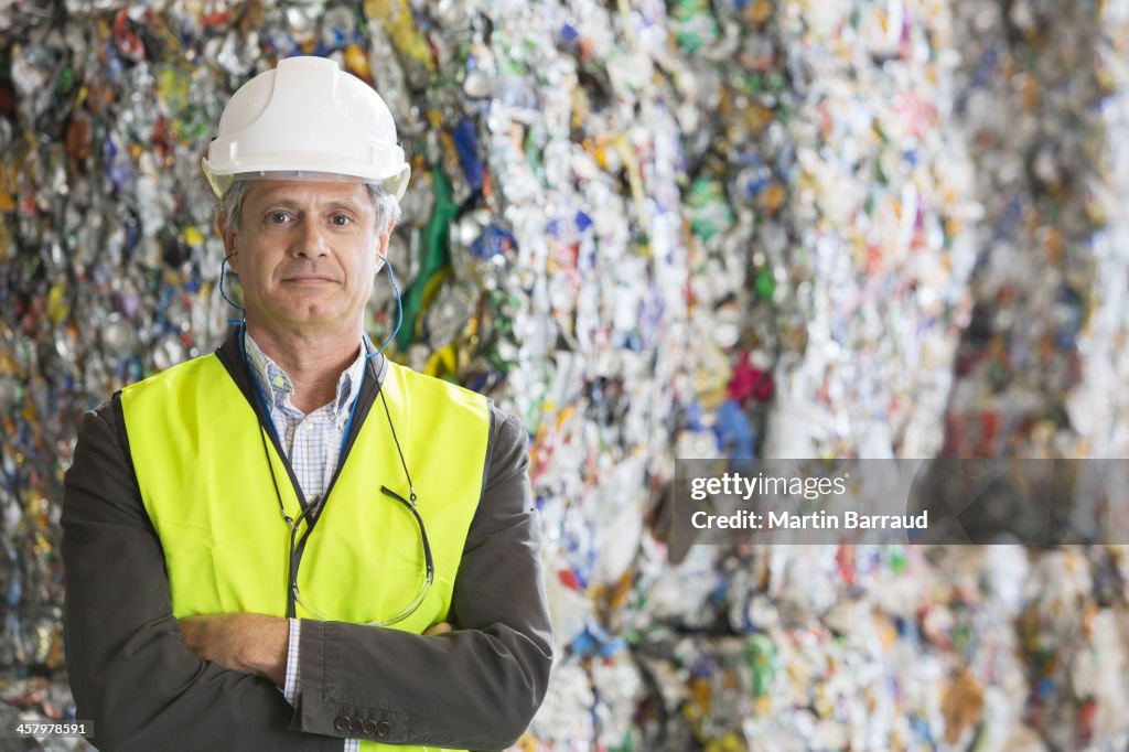 Supervisor standing in recycling plant