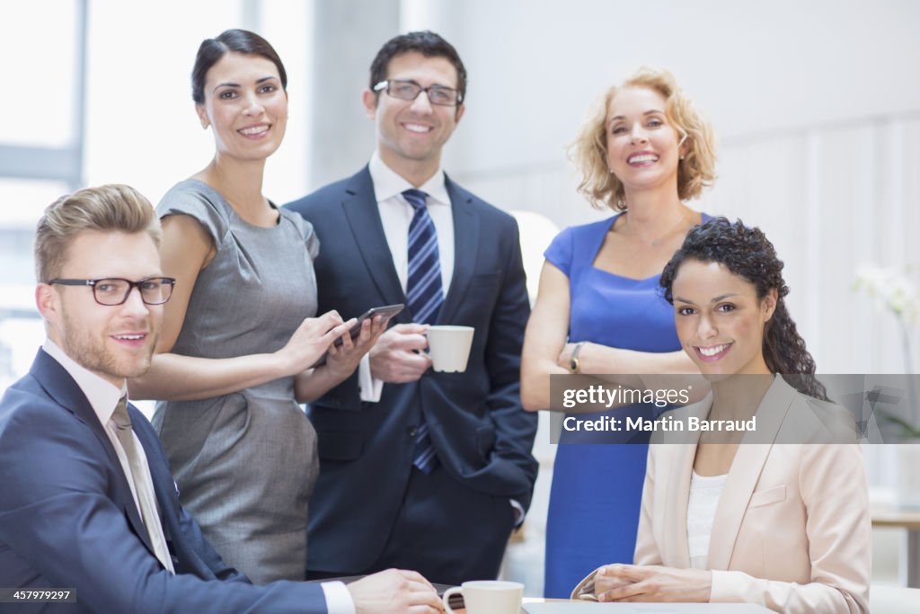 Business people smiling in meeting