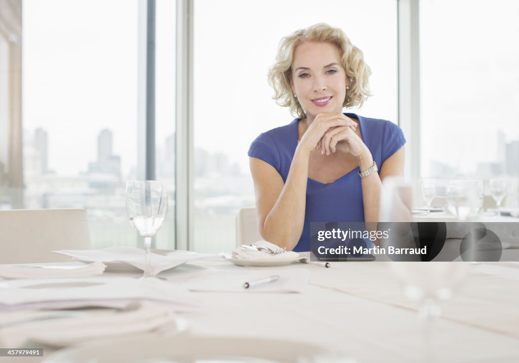 Businesswoman sitting in restaurant