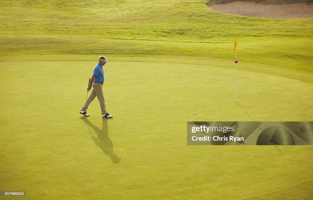 Man walking on golf course