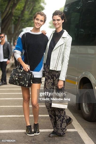 Models Pauline Hoarau and Manon Leloup exit the Giorgio Armani show on Day 4 of Milan Fashion Week Spring/Summer 2015 on September 20, 2014 in Milan,...