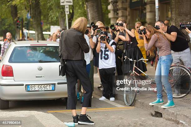 Estonian model Alexandra Elizabeth enjoys a gelato after Jil Sander while carrying a 3.1 Phillip Lim purse and wearing Marc by Marc Jacobs sneakers...