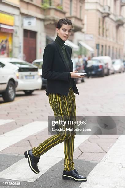 German model Larissa Hofmann exits the Giorgio Armani show on Day 4 of Milan Fashion Week Spring/Summer 2015 on September 20, 2014 in Milan, Italy