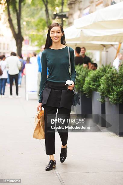 Chinese model Fei Fei Sun exits Jil Sander on Day 4 of Milan Fashion Week Spring/Summer 2015 on September 20, 2014 in Milan, Italy