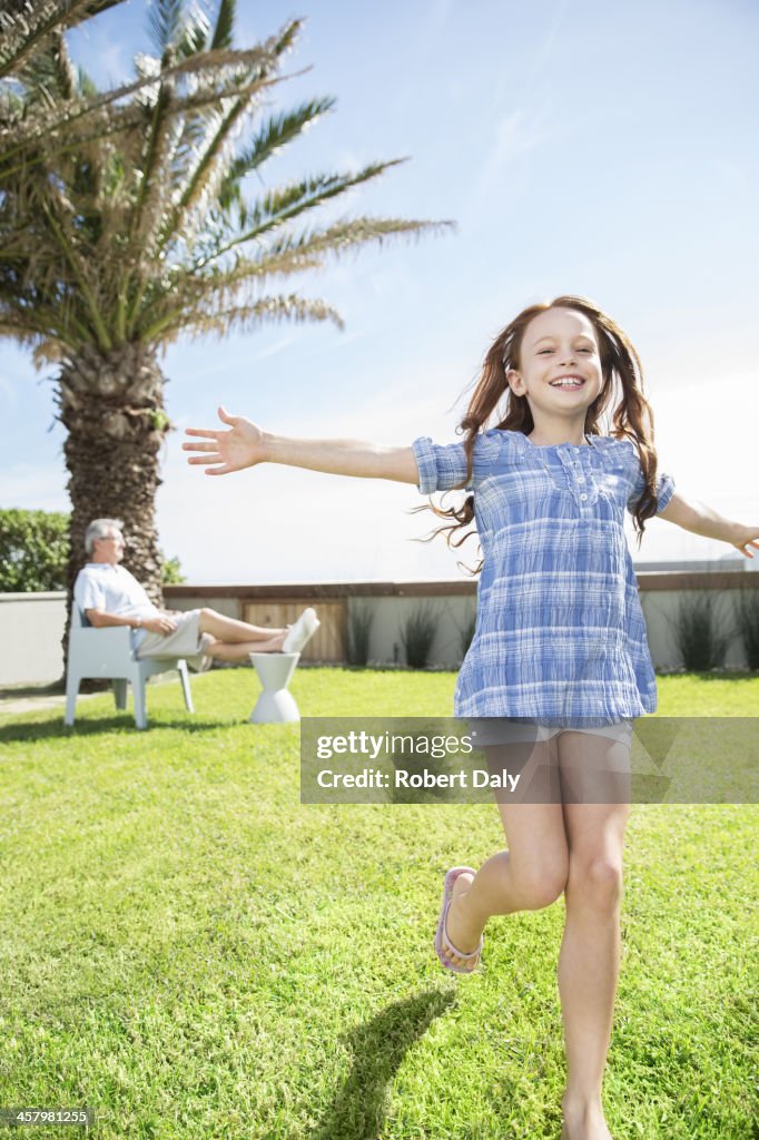 Girl playing in backyard