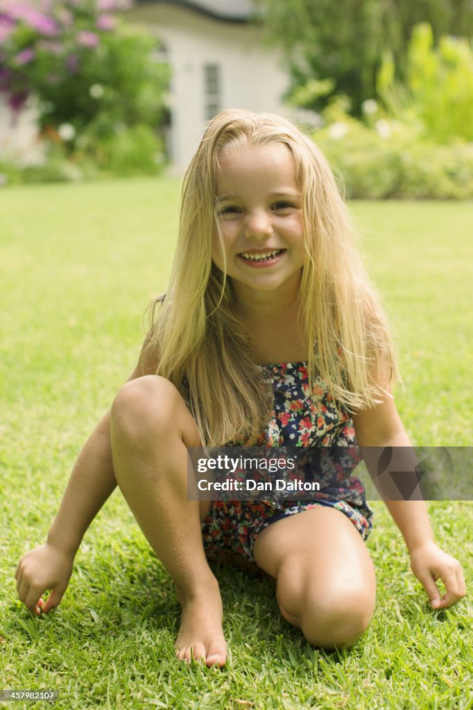 Girl smiling in backyard