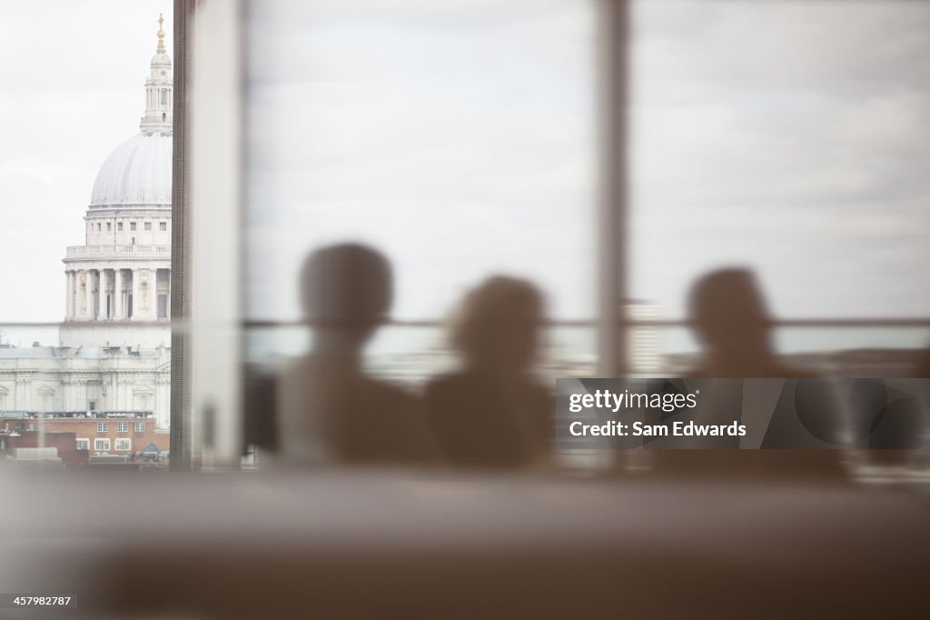 Silhouette of business people in meeting