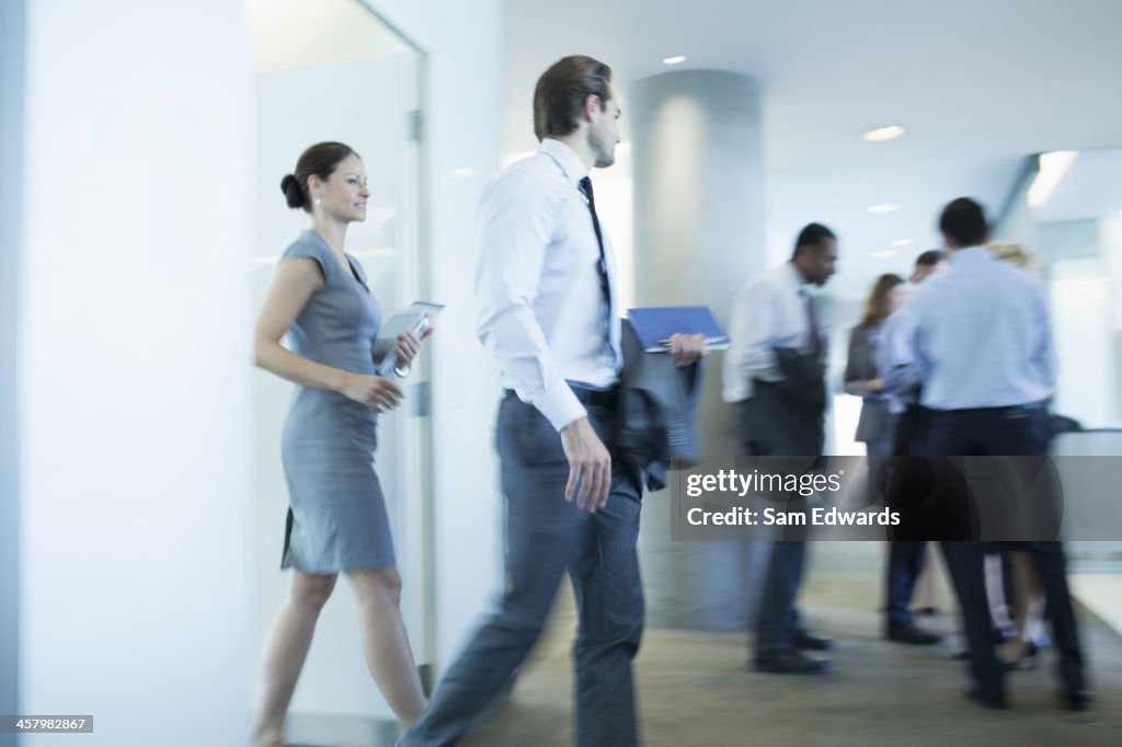 Business people walking in office