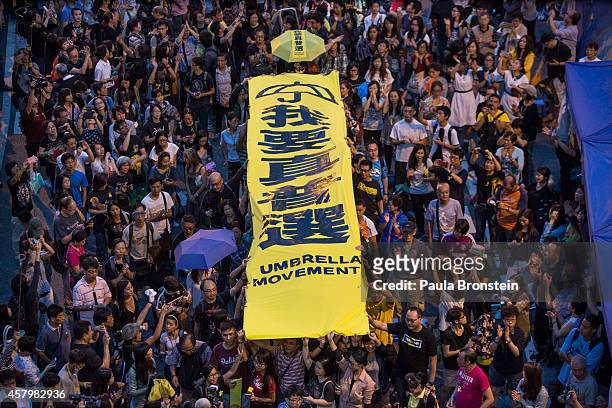 Protesters fill the streets as tens of thousands come to the main protest site one month after the Hong Kong police used tear gas to disperse...