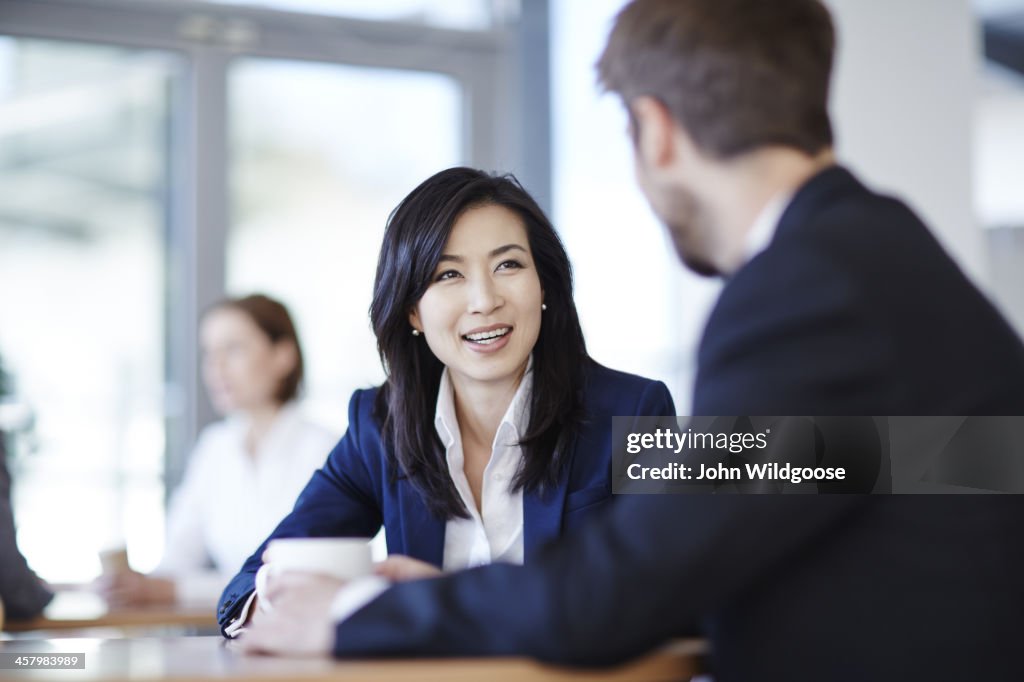 Business people talking in cafe