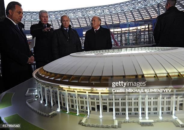 - Russian Sport Minister Vitaly Mutko, Moscow's Mayor Sergey Sobyanin, Russian President Vladimir Putin and FIFA President Sepp Blatter look at the...