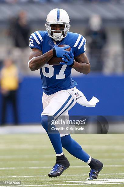 Reggie Wayne of the Indianapolis Colts catches a pass during the game against the Cincinnati Bengals on October 19, 2014 at Lucas Oil Stadium on...