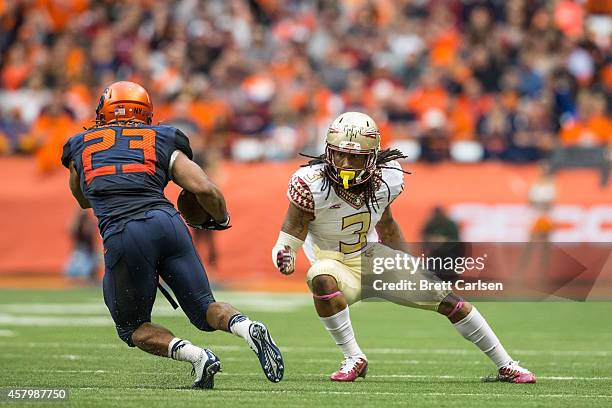 Ronald Darby of the Florida State Seminoles defends against Prince-Tyson Gulley of the Syracuse Orange on October 11, 2014 at The Carrier Dome in...