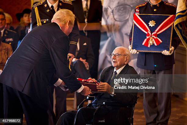 Sir Nicholas Winton receives the Order of White Lion, the highest order of the Czech Republic, from Czech President Milos Zeman during the...