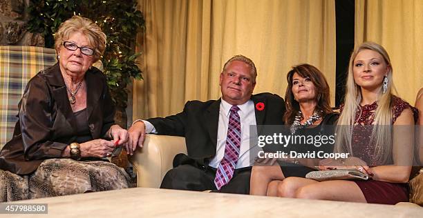 Doug Ford puts on a brave face after John Tory had been declared the winner. Mother Diane, and wife Karla and daughter Kyla beside her mom, watch the...
