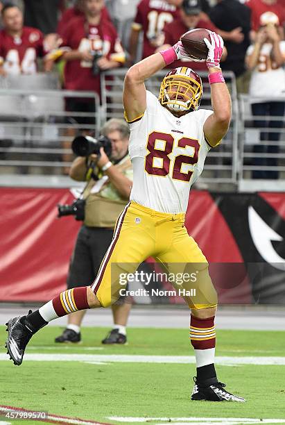 Logan Paulsen of the Washington Redskins makes a catch during pregame prior to a game against the Arizona Cardinals at University of Phoenix Stadium...