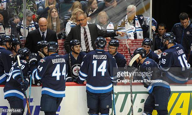 Head Coach Paul Maurice of the Winnipeg Jets points as he instructs his players during a timeout in second period action against the Calgary Flames...
