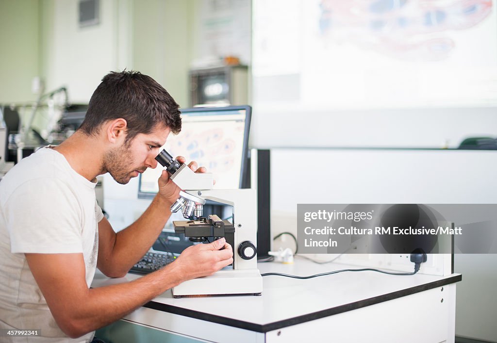 Medical students with microscopes